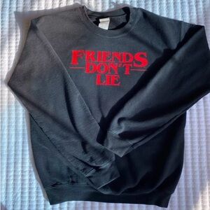 Black with white words Friends don’t lie crew neck sweatshirt